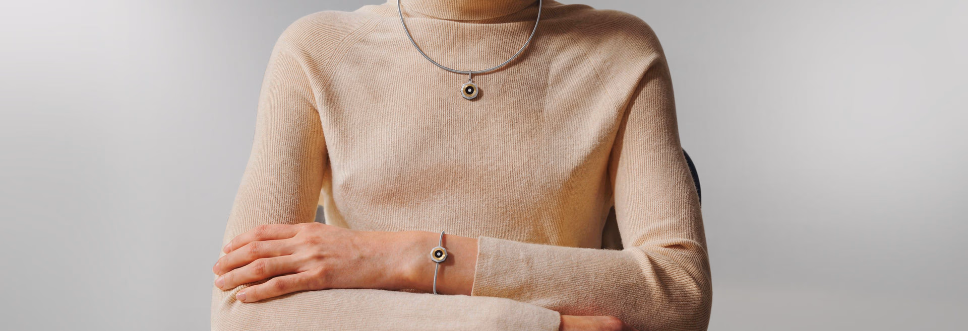 Autic World titanium necklace and bracelet, worn